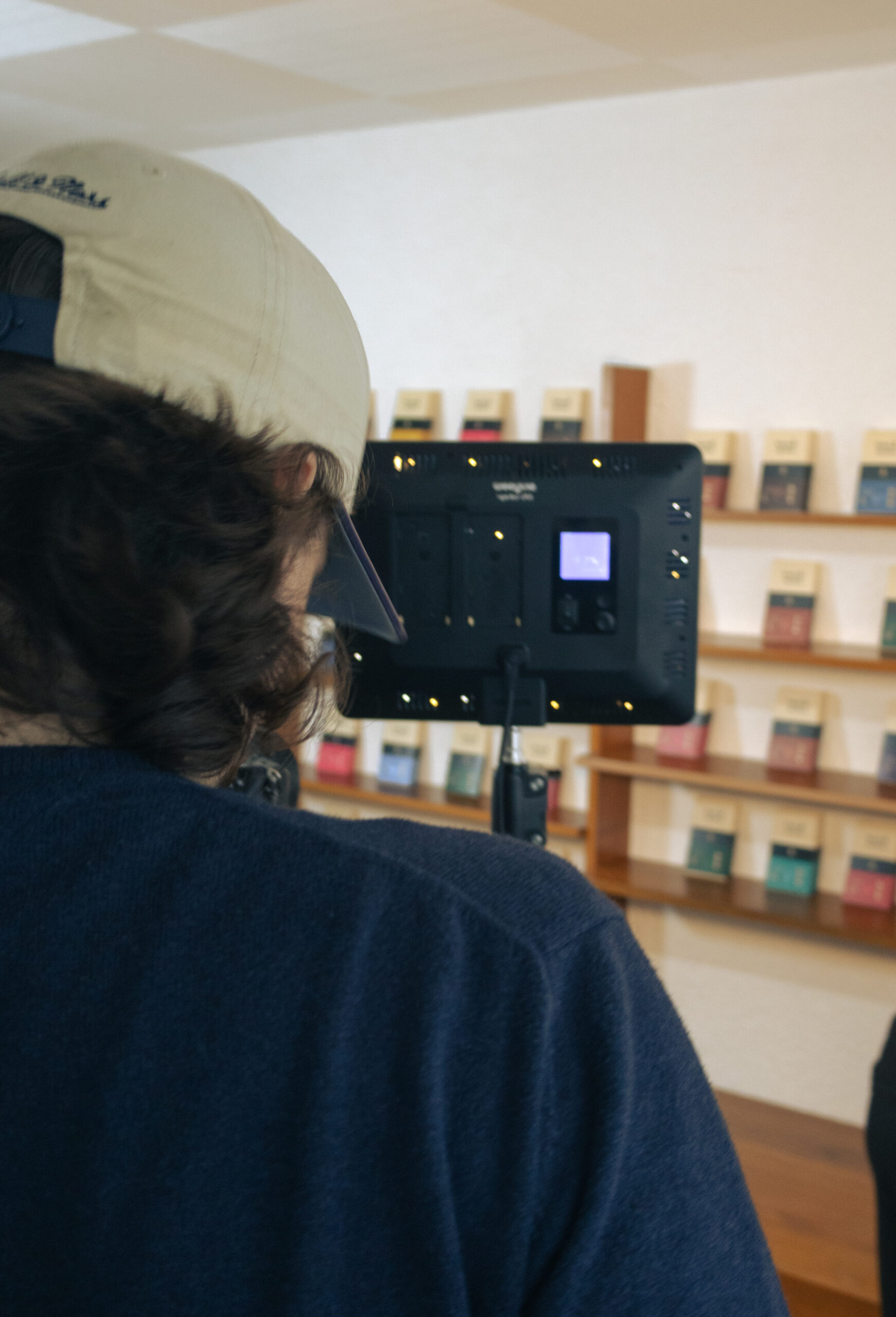 three people sitting in front of table laughing together